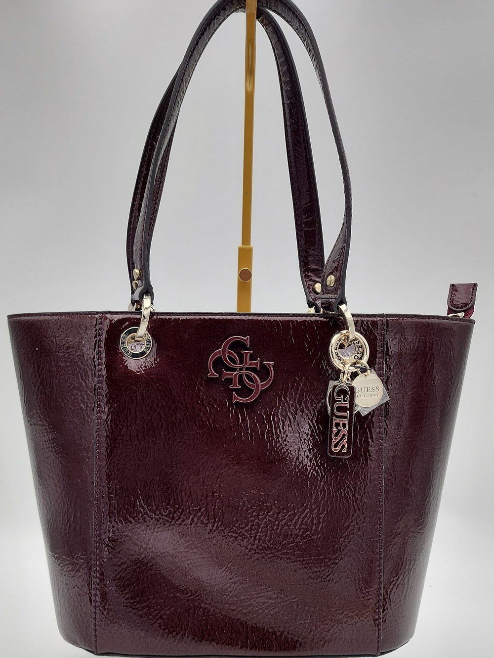 GUESS Patent Tote in Deep Wine